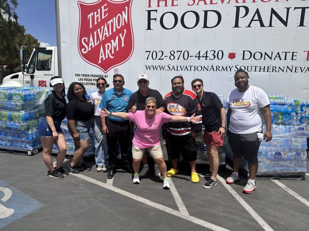 Group shot of KKLZ staffers with Salvation Army Truck
