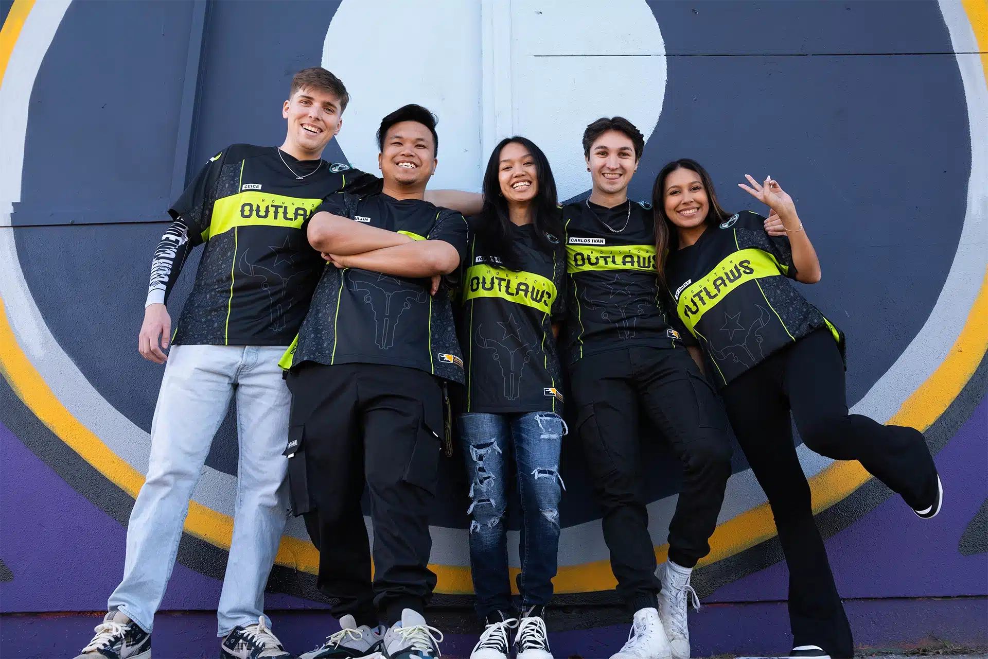 outlaws entertainment gen z influencers posing in outlaws t-shirts